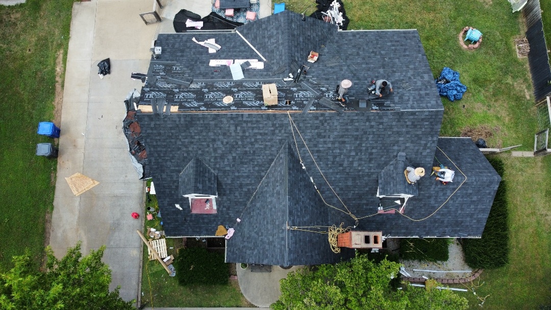 Residential replacement mid-installation — crew working